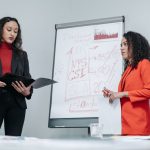 Female entrepreneur reviewing affiliate marketing strategy for her business