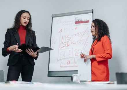 Female entrepreneur reviewing affiliate marketing strategy for her business