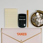 Female entrepreneur reviewing tax credit documents to maximize savings