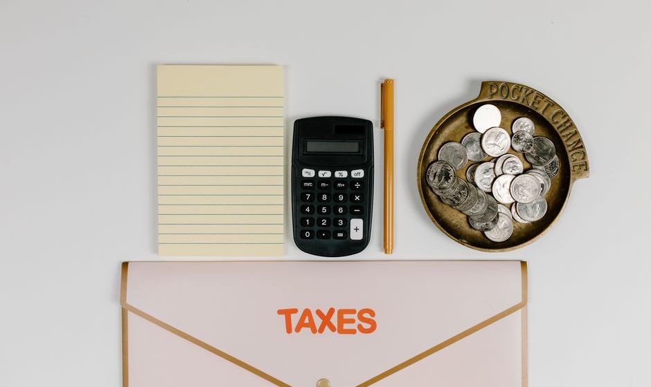Female entrepreneur reviewing tax credit documents to maximize savings